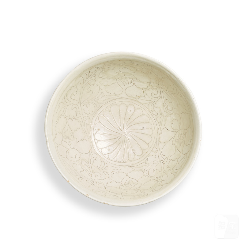 A carved Dangyangyu white-glazed 'peony' bowl, Song dynsaty | 宋 當陽峪窰白釉刻纏枝牡丹紋盌